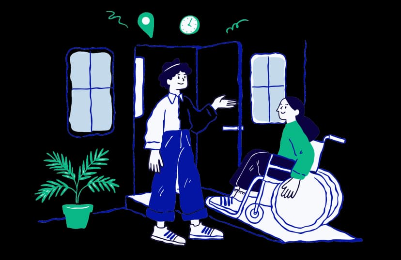A helper welcoming a wheelchair user at a ramped doorway